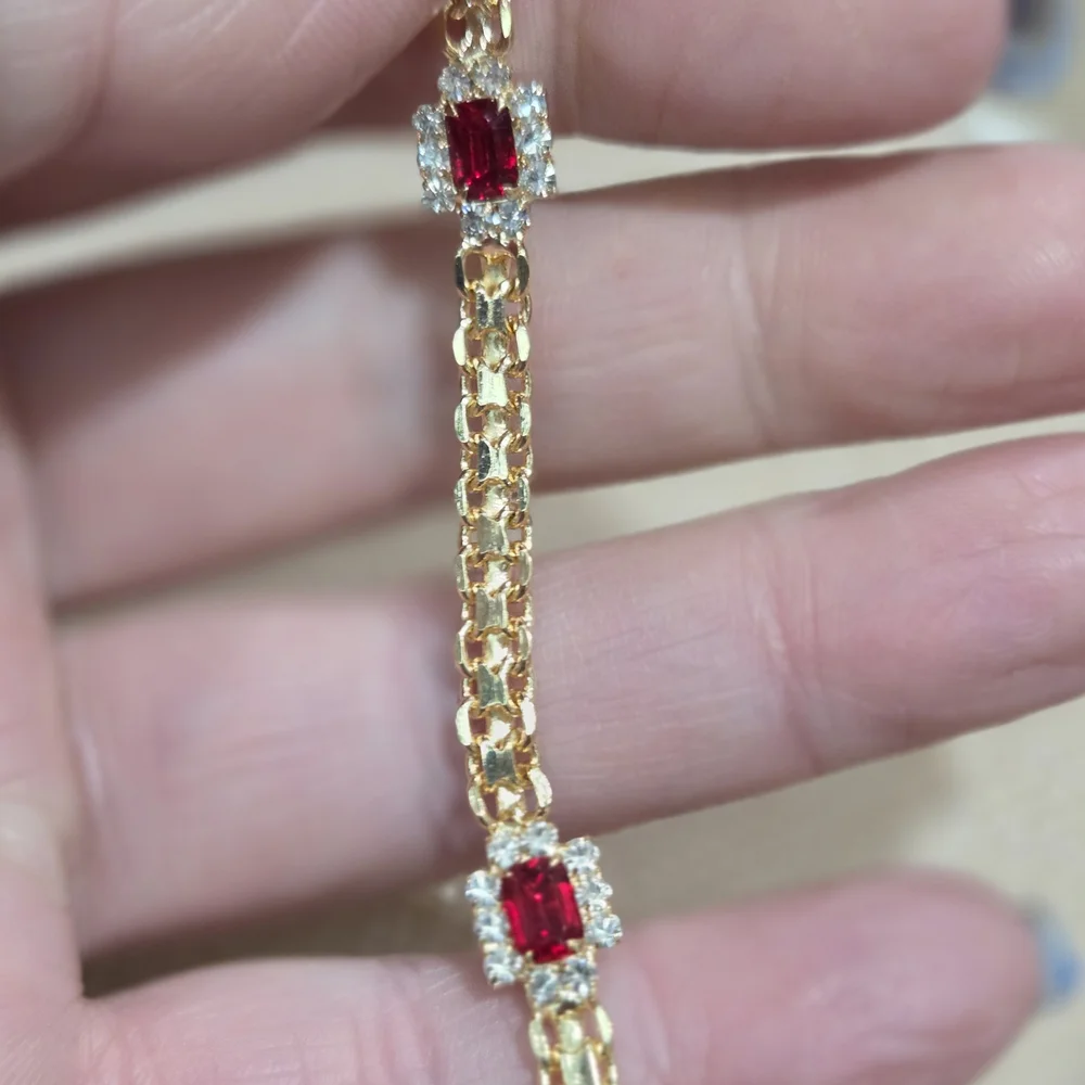 Elegant Gold Bracelet with Ruby Accents